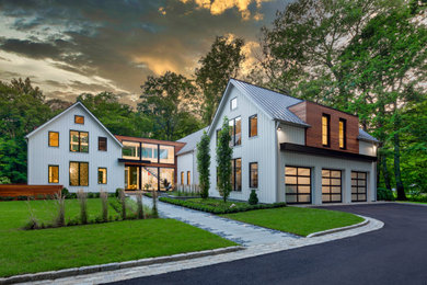 Farmhouse white two-story wood and clapboard exterior home photo in New York with a metal roof and a gray roof