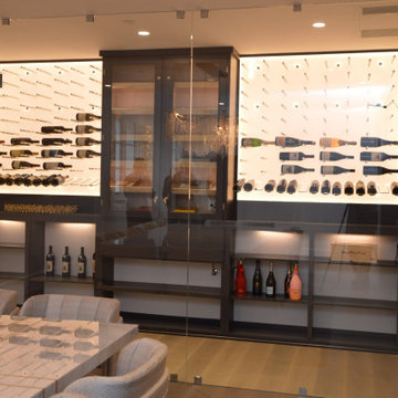 Small Wine Closet with a Frameless Glass Enclosure