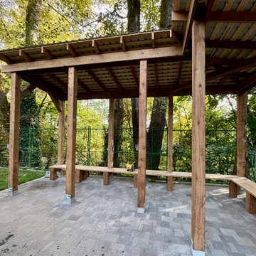 Lean to style custom cedar pergola with bench seating