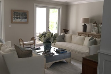 This is an example of a mid-sized transitional enclosed living room in Miami with beige walls and dark hardwood floors.