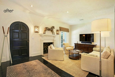 Example of a mid-sized classic open concept dark wood floor living room design in Boston with white walls, a standard fireplace, a plaster fireplace and a tv stand