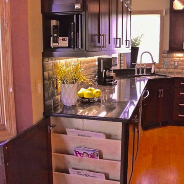 Upper cabinet charging station & magazine rack at the end of base cabinet