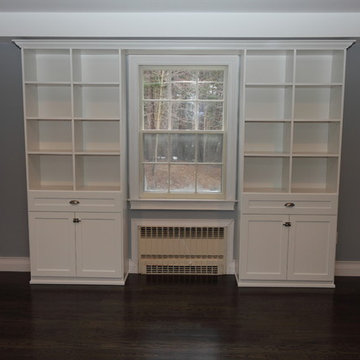 Wall Unit around window in white melamine with shaker thermofoil doors.