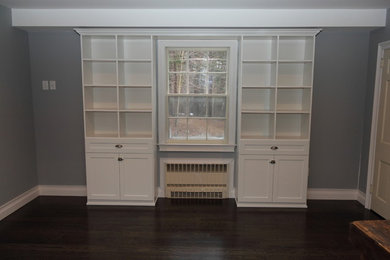 Wall Unit around window in white melamine with shaker thermofoil doors.