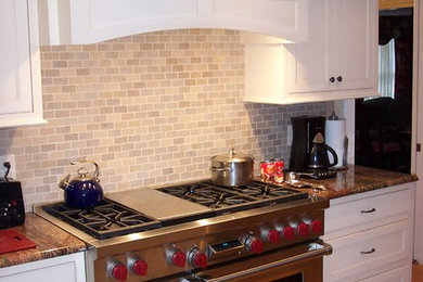 Example of a classic eat-in kitchen design in Boston