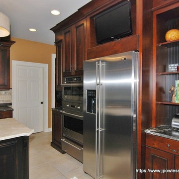 Kitchen Knotty cherry with black wrought iron accents