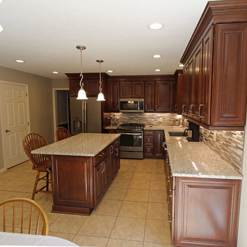 Waypoint Cherry Chocolate Cabinets and Giallo Ornamental Granite Countertops