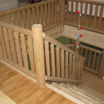 Half log staircase with a cedar railing