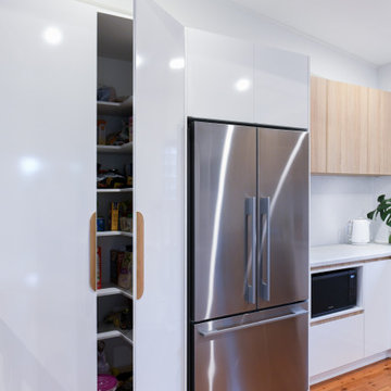 Step in pantry with U-shaped shelves