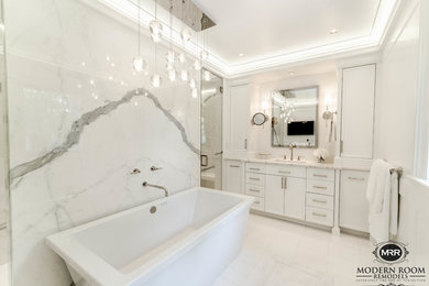 Large trendy master white tile and porcelain tile marble floor and white floor bathroom photo in New York with flat-panel cabinets, white cabinets, a wall-mount toilet, white walls, an undermount sink, quartz countertops, a hinged shower door and white countertops