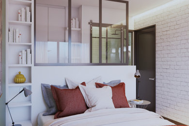パリにある小さなインダストリアルスタイルのおしゃれな主寝室 (白い壁、ラミネートの床、暖炉なし、茶色い床、レンガ壁)