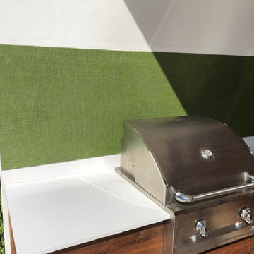 Outdoor grill with green glass mosaic