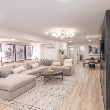 Warm & Inviting Basement Retreat with Custom Bar + Entertainment Center
