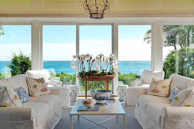 Example of an island style family room design in Boston