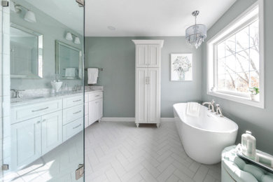 Example of a large french country master ceramic tile, white floor and double-sink bathroom design in Minneapolis with shaker cabinets, white cabinets, a one-piece toilet, blue walls, an undermount sink, a hinged shower door, white countertops and a built-in vanity