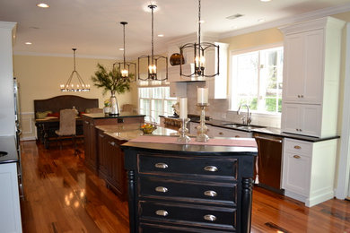 Inspiration for a timeless galley eat-in kitchen remodel in Baltimore with an undermount sink, beaded inset cabinets, white cabinets, quartz countertops, white backsplash, subway tile backsplash and stainless steel appliances