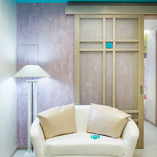 This is an example of a mid-sized eclectic foyer in Saint Petersburg with metallic walls, ceramic floors, a single front door, a light wood front door and grey floor.
