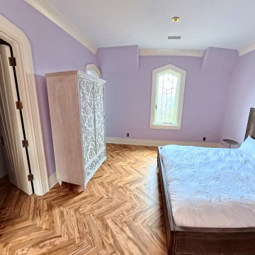 Custom Luxury Bedroom with Artistic Design and Herringbone Flooring