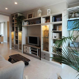 Example of a mid-sized cottage chic open concept porcelain floor family room design in Florence with white walls and a media wall
