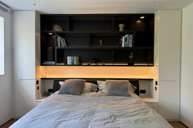 Photo of a large modern guest bedroom in London.