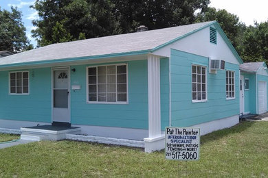 Mid-sized traditional blue one-story concrete exterior home idea in Tampa