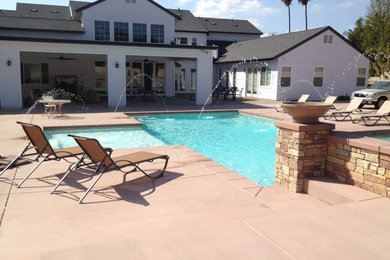 Inspiration for a mid-sized craftsman backyard concrete and custom-shaped natural pool fountain remodel in Orange County