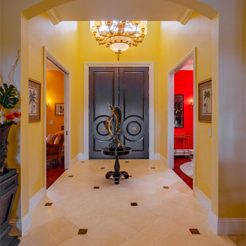 Grand Entry With Custom Double Doors, Ornate Chandelier, and Classic Marble Floo