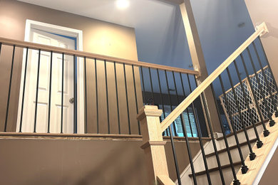 Inspiration for a mid-sized contemporary wooden l-shaped mixed material railing staircase remodel in Philadelphia with wooden risers