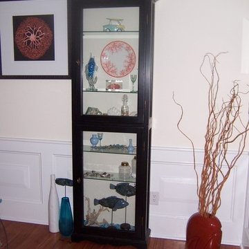 Nautical Hallway Display cabinet filled with beachy finds and wall art