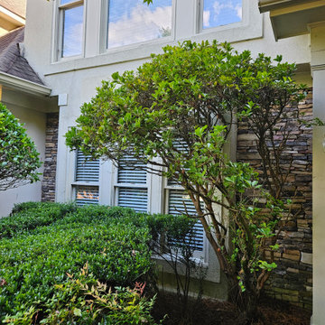 Stacked Stone Dining Room Exterior with Square Bay Window