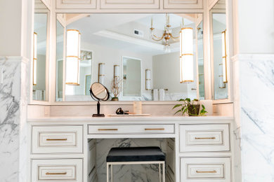Inspiration for a large transitional master white tile and stone slab marble floor and white floor bathroom remodel in Cleveland with white cabinets, marble countertops, white countertops and a built-in vanity