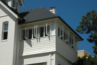Photo of a traditional home design in Sydney.