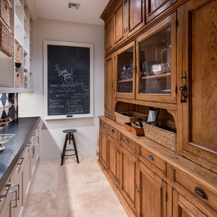 Traditional kitchen pantry designs - Inspiration for a timeless galley beige floor kitchen pantry remodel in Phoenix with recessed-panel cabinets, medium tone wood cabinets, white backsplash and gray countertops