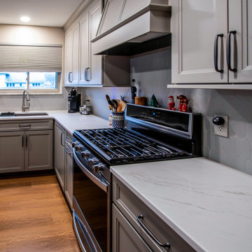 Two-Tone Neutral Kitchen with Quartz Countertop and Soho Picket Backsplash
