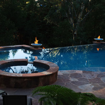 Custom Negative Edge Swimming Pool with Fire Bowls