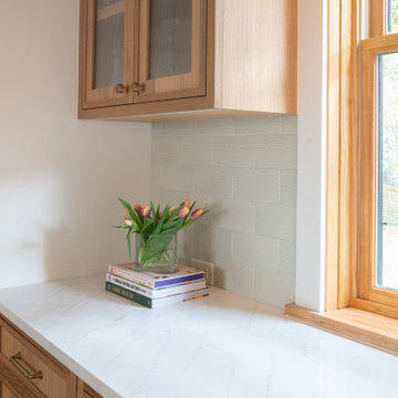 Warm Modern Kitchen Renovation with Natural Oak & Green Accents