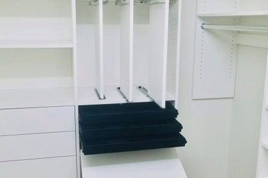 Built-in closet - large contemporary built-in closet idea in Other