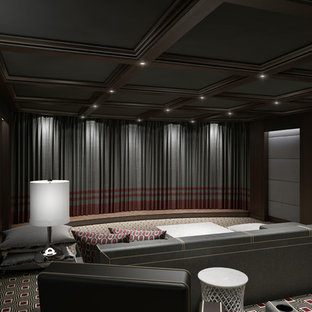 Example of a large trendy enclosed carpeted home theater design in New York with gray walls and a projector screen