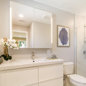 Bright bathroom with backlit mirrors