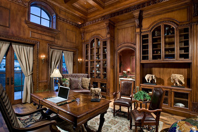 Study room - huge traditional freestanding desk medium tone wood floor and brown floor study room idea in Phoenix