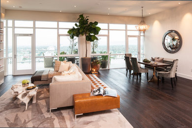 Example of a trendy open concept living room design in Los Angeles with white walls