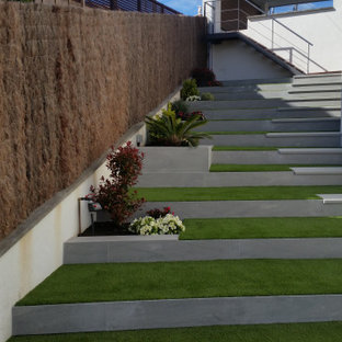 Design ideas for a medium sized modern curved staircase in Other with limestone treads and tiled risers.