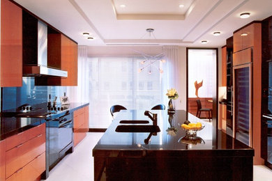 Example of a large trendy u-shaped porcelain tile and white floor eat-in kitchen design in Montreal with an undermount sink, flat-panel cabinets, medium tone wood cabinets, granite countertops, black backsplash, stone slab backsplash, stainless steel appliances and an island