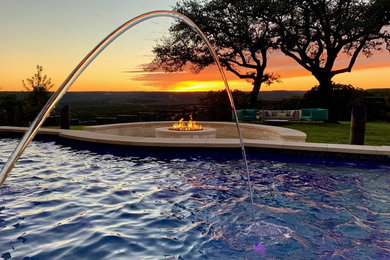 Inspiration for a mid-sized contemporary backyard concrete and rectangular pool fountain remodel in Austin
