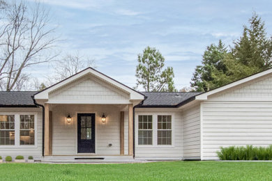 Example of a large white one-story mixed siding exterior home design in DC Metro with a shingle roof and a gray roof