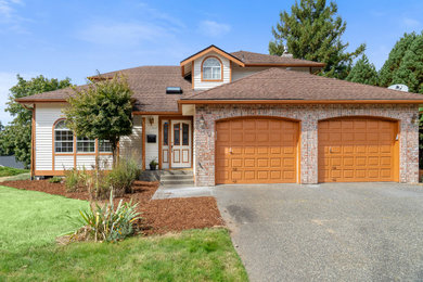 Large multicolored two-story house exterior idea in Seattle