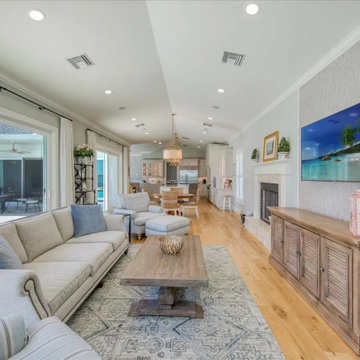 Open Concept Living Room with Soft Neutrals and Pool Views