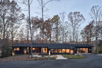 Mid-century modern exterior home idea in Charlotte