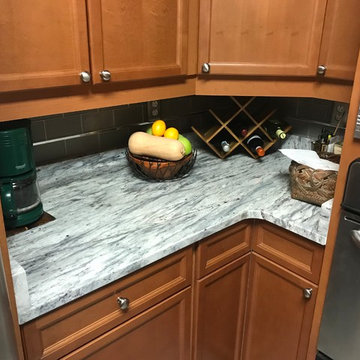 Welcoming, traditional design kitchen in "Thunder White" granite countertops