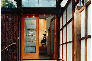 Mid-sized trendy ceramic tile and brown floor entryway photo in San Francisco with brown walls and a brown front door